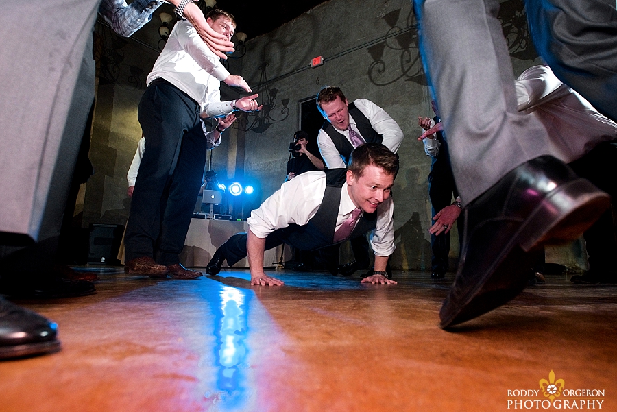 groom goes down on the dancefloor at The Olde Dobbin Station in Texas