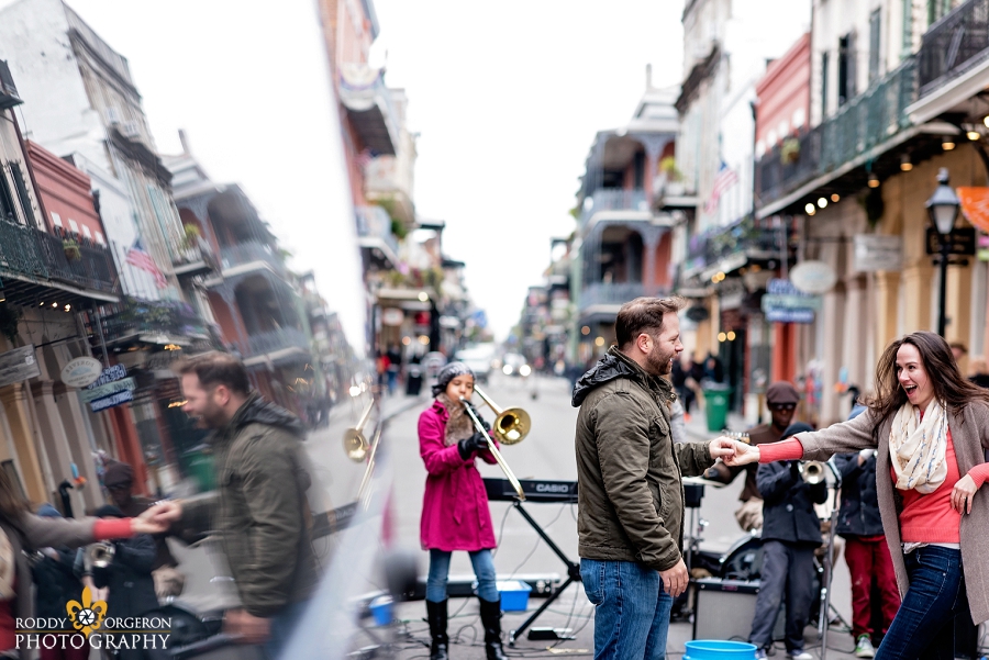New Orleans Engagement Session on Frenchman street with a street band and the couple dancing