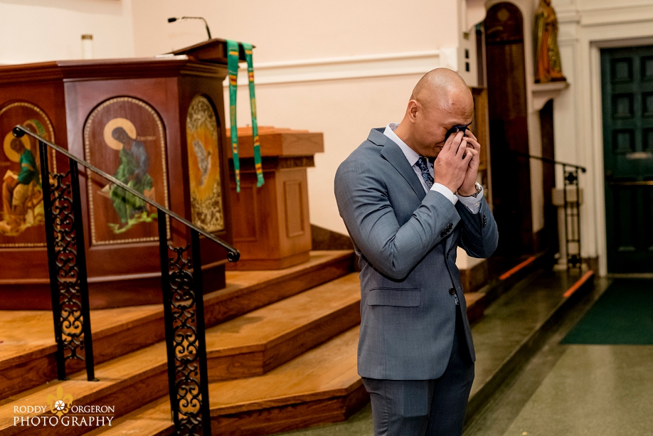 the groom cries as he sees his bride for the first time at Our Lady of Guadalupe Church in the French Quarter New Orleans