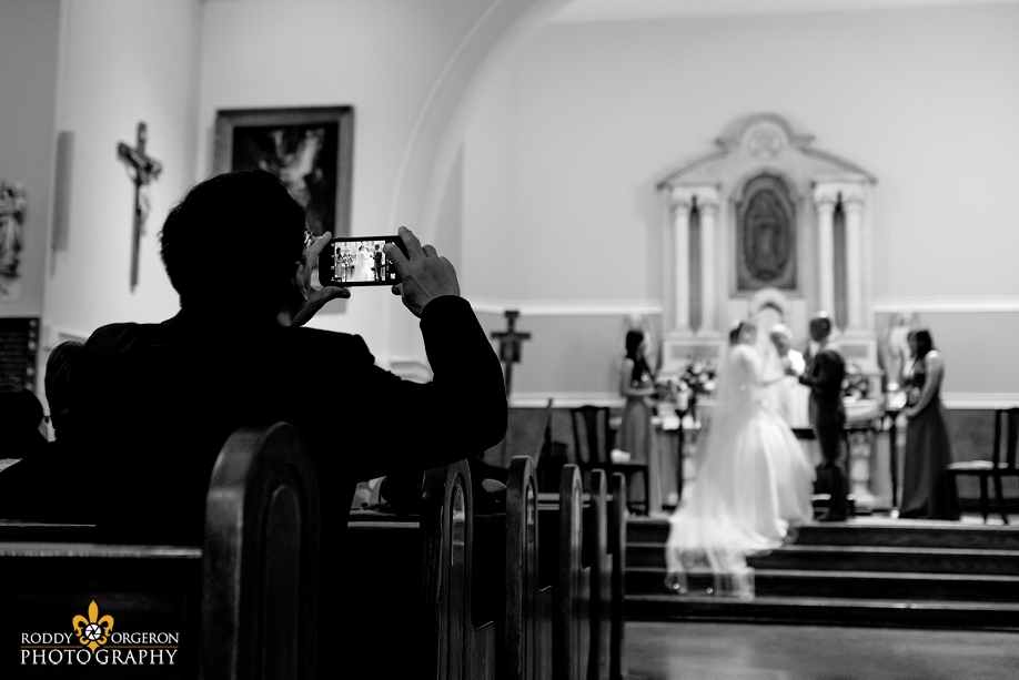 bride and groom at the alter at Our Lady of Guadalupe Church in the French Quarter New Orleans