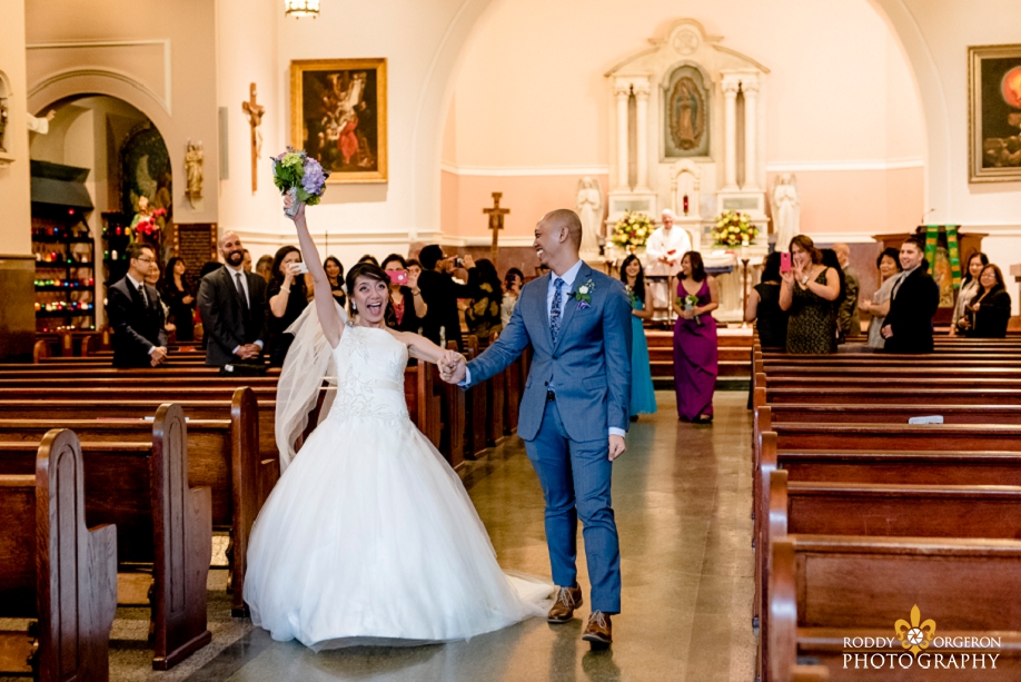 bride and groom exit the church at Our Lady of Guadalupe Church in the French Quarter New Orleans