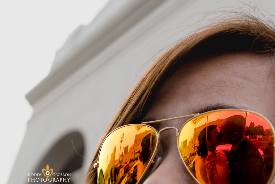 reflection of bride and groom in sunglasses at Our Lady of Guadalupe Church in the French Quarter New Orleans