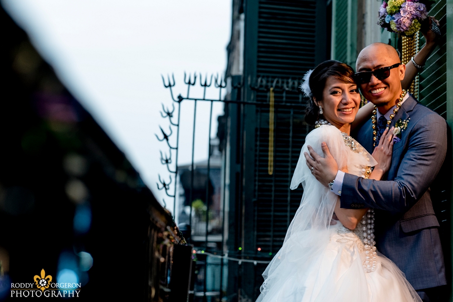 bride and groom portraits in the French Quarter New Orleans on a balcony