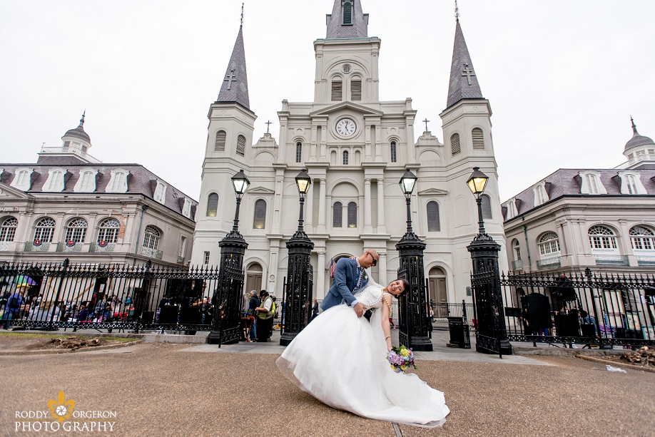 bride and groom in front of the Cathedral in the French Quarter New Orleans