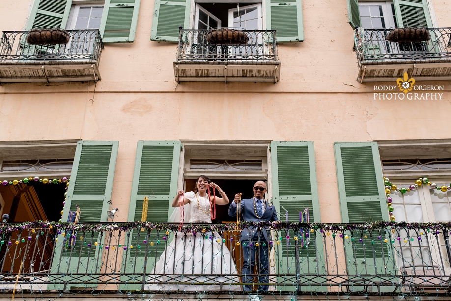 bride and groom on a balcony in the French Quarter New Orleans