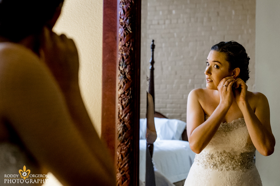 Beautiful bride looking in the mirror as she prepares for her big day