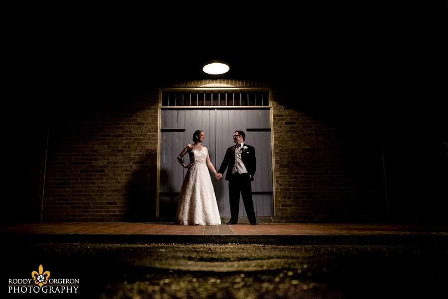 creative portraits with the bride and groom holding hands at the Hampton Inn New Orleans