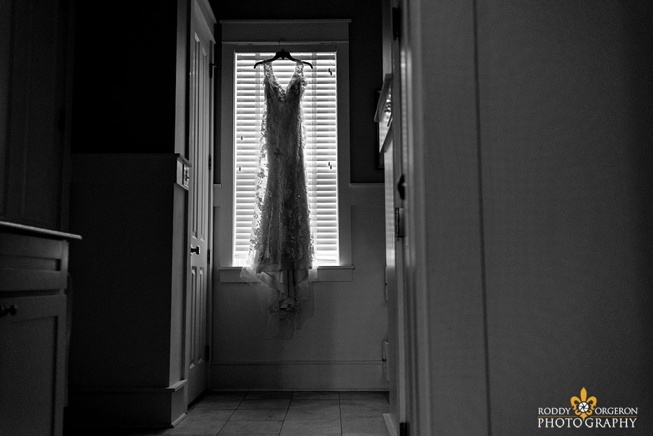 Bridal gown hanging in window