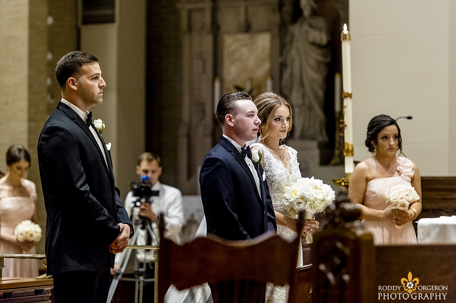 bride and groom at alter of Ursuline church in New Orleans