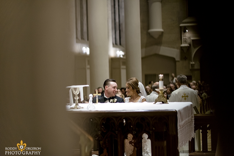 bride and groom look at each other at Ursuline church in New Orleans