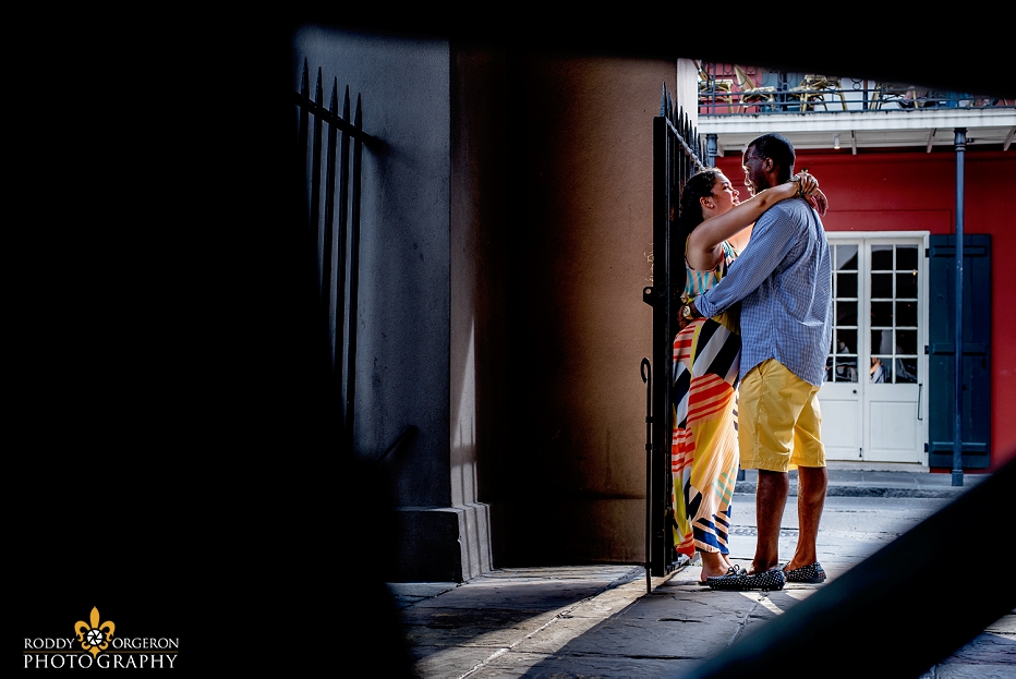 Portrait of soon to be bride and groom after their proposal by Pirates Alley in New Orleans