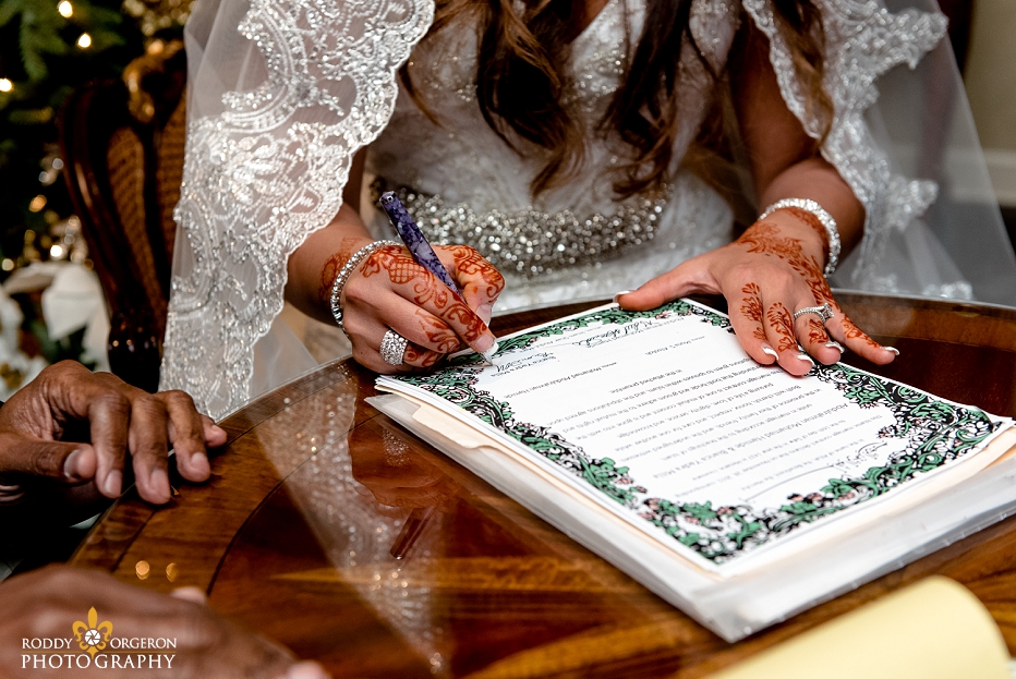 Indian wedding - bride signing marriage license