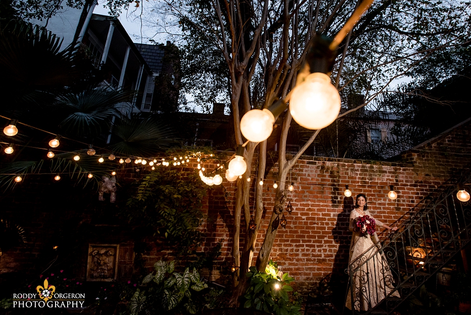 Bride in wedding dress in New Orleans in a courtyard