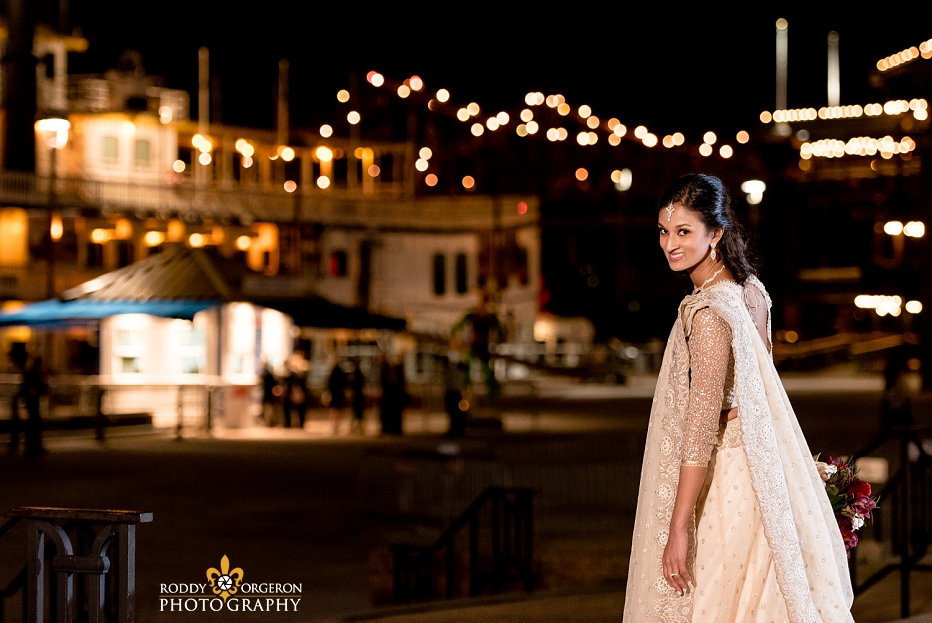Bride in wedding dress in New Orleans by the Mississippi River