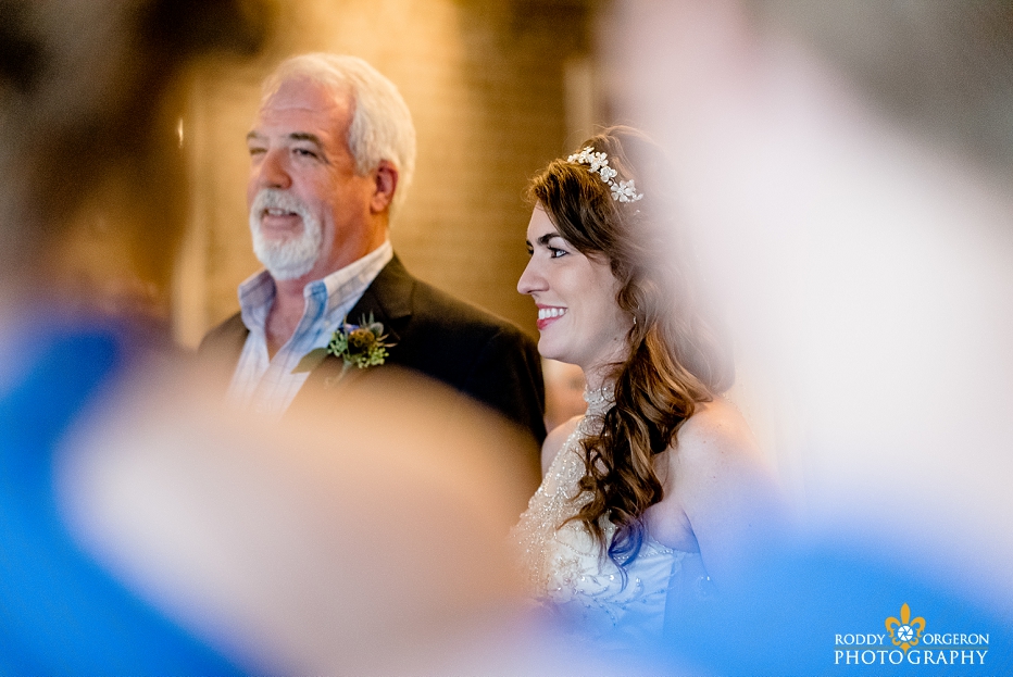 A father hands his daughter to her husband at the Chicory wedding venue