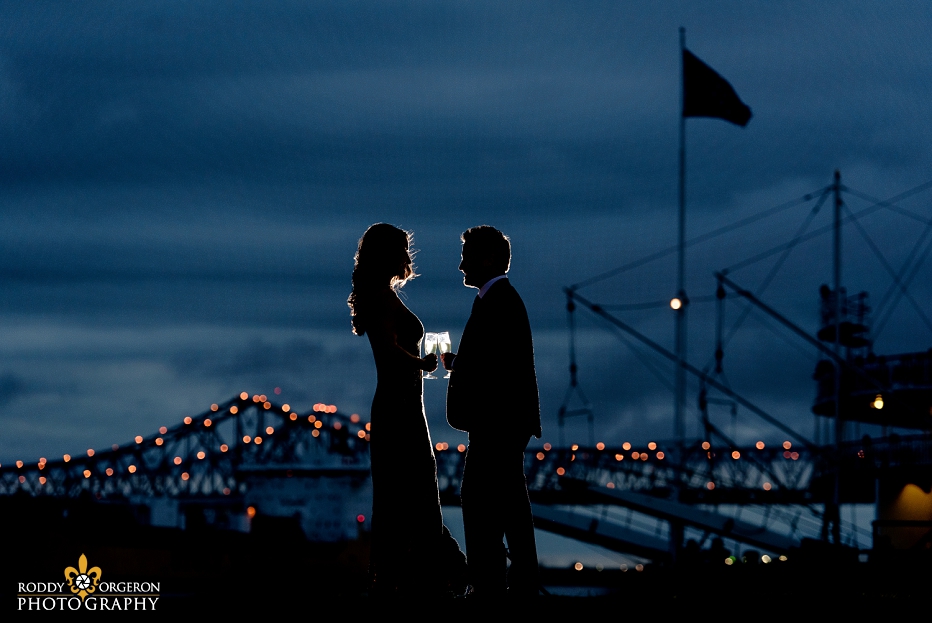 Bride and Groom Engagement Session in New Orleans with the bridge in the background