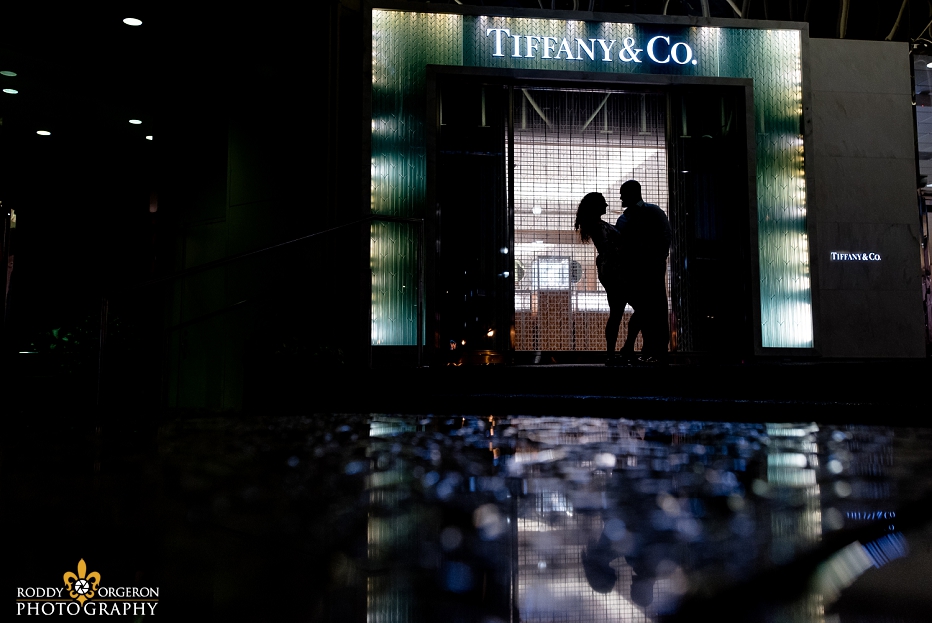 Engagement Session in New Orleans with the couple as a silhouette in front of Tiffany & Co.