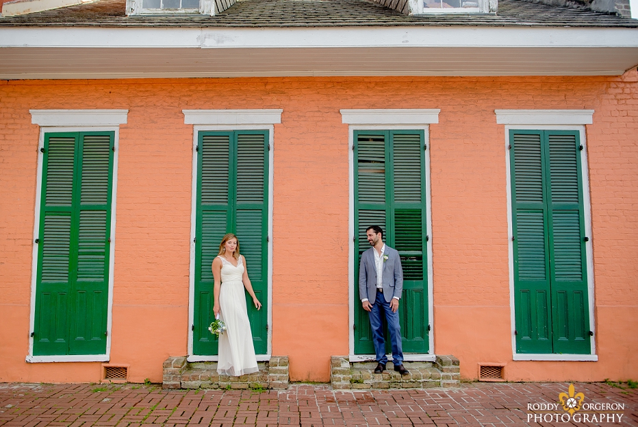 Bride and groom in front of an old New Orleans home in the French Quarter in New Orleans