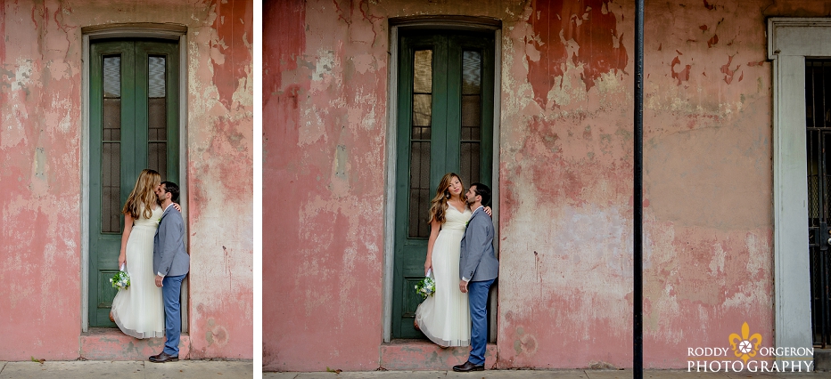 Bride and groom standing in front of an old New Orleans home in the French Quarter in New Orleans