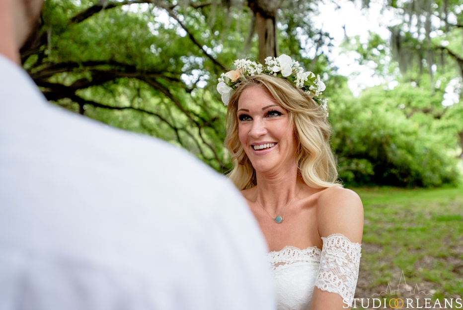 City Park Elopement under an Oak tree as bride smiles at groom