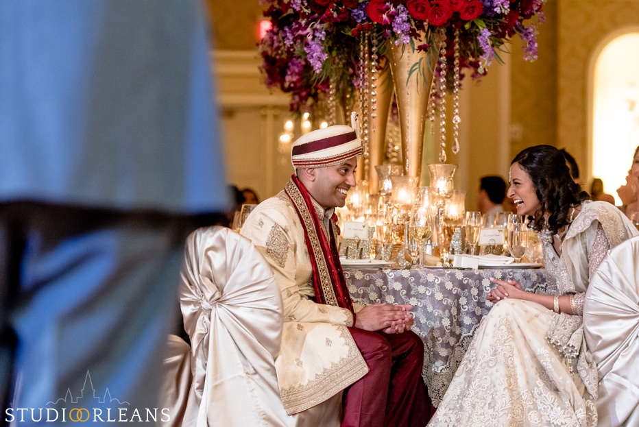 New Orleans Indian wedding reception -The Roosevelt hotel - bride and groom laughing with the Bellytwins international