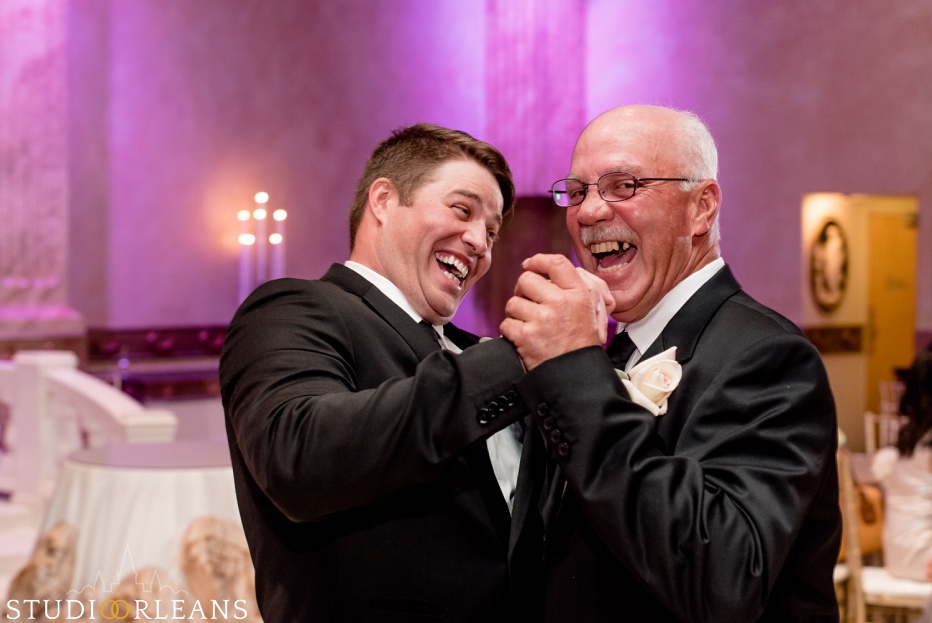 The groom and his father in law dancing at The Balcony Ballroom