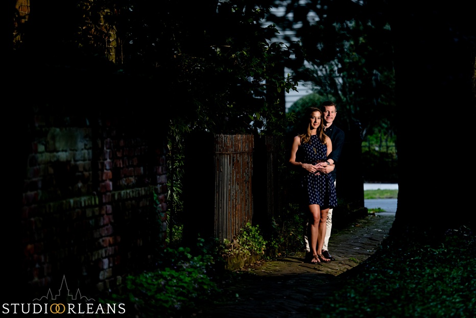 A couple standing on a sidewalk in New Orleans for an engagement session