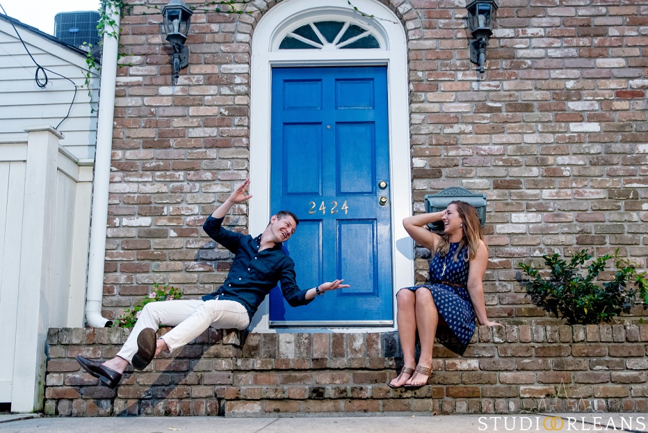 A couple sitting on a step in New Orleans for an engagement session
