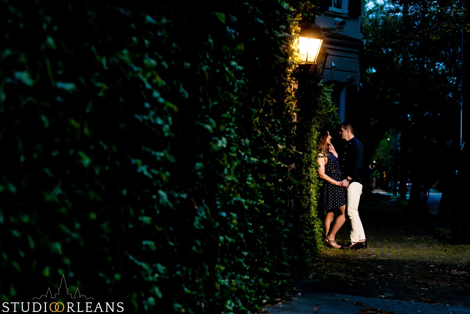 A couple standing on a sidewalk in New Orleans for an engagement session