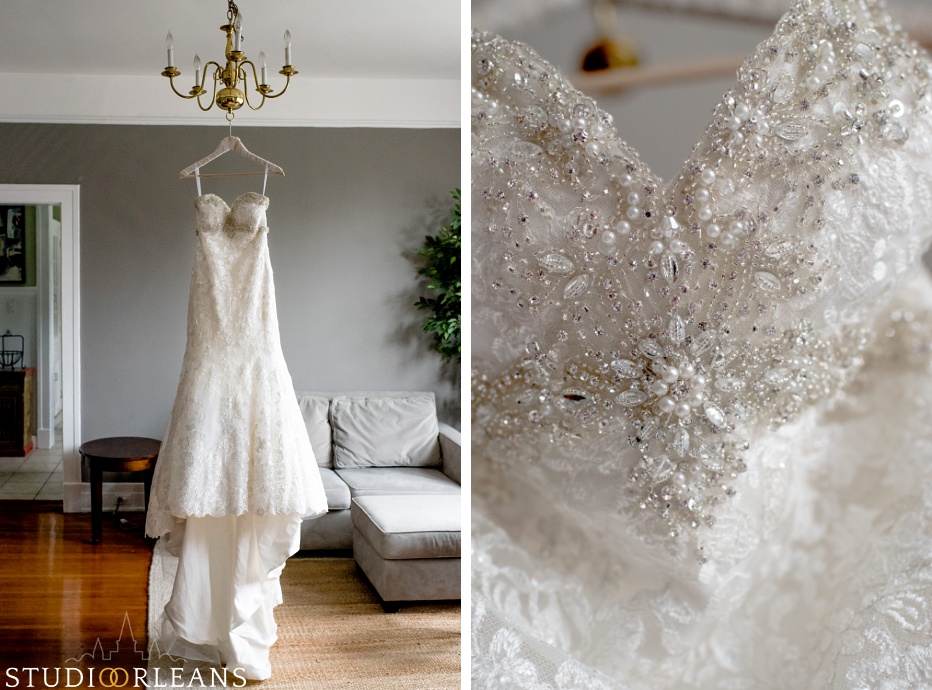 Beautiful wedding dress hanging from a chandelier