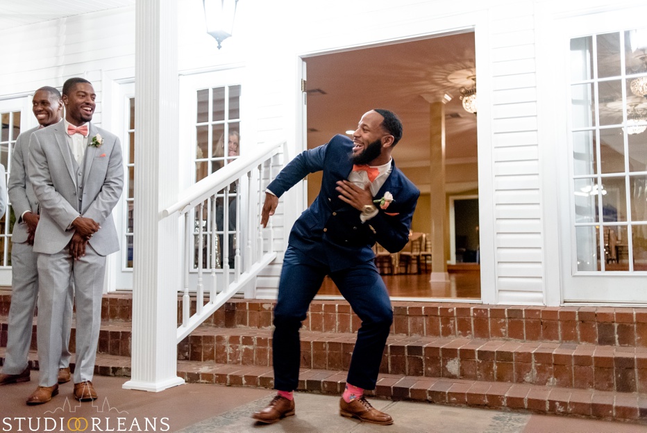 The groom dancing as it gets closer to his bride. This was taken at Cedar Grove Plantation. Photo by Studio Orleans New Orleans Photographers