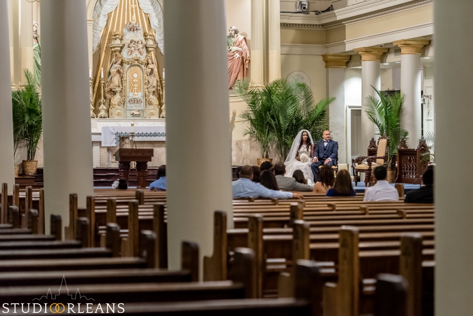 Bride and groom at the alter at the Saint Louis Cathedral in New Orleans