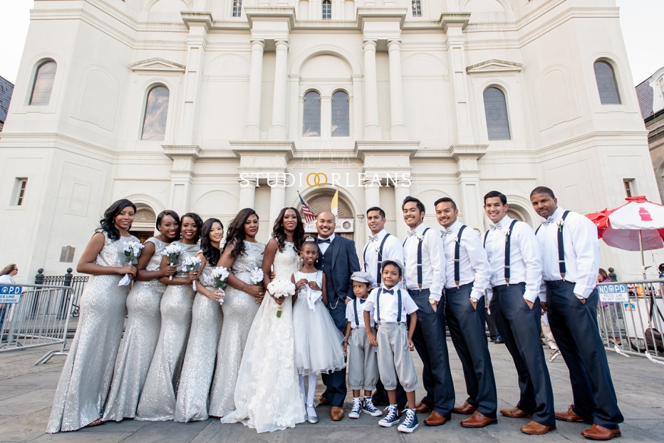 The bride, groom and bridal party outside of the Saint Louis Cathedral in New Orleans