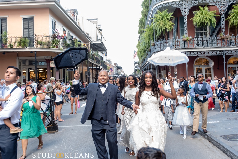 Big Fun Brass band leads the bride and groom down Bourbon Street for the second line in New Orleans