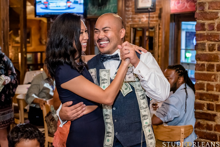 The groom dances with a guest at Oceana Grill in the French Quarter of New Orleans. An Oceana Grill Wedding