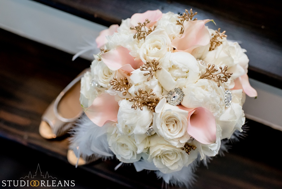 Beautiful bouquet of flowers on steps with brides shoes in New Orleans