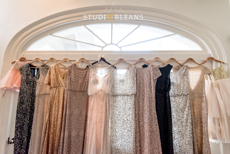 bride and bridesmaids dresses hanging up before the wedding