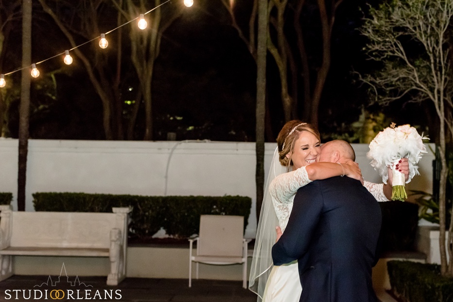A bride and groom have a "first look" in a New Orleans courtyard