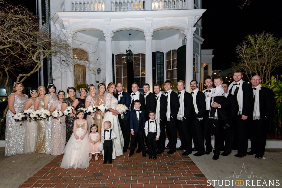 Entire bridal party in front of the mansion after the wedding