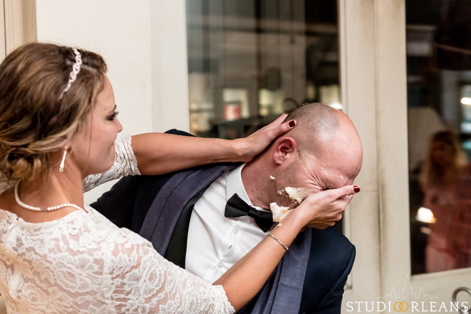 The bride smashed the cake in the face of the groom at Belovo lights in New Orleans