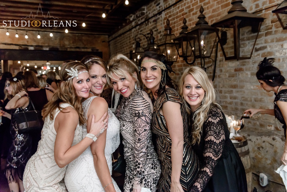 A beautiful bride and her friends pose at Belovo lights in New Orleans