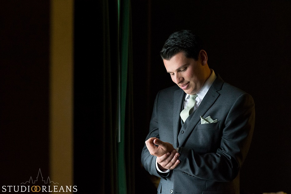 Chateau Lemoyne Wedding - The groom fixing his cuff link before the ceremony
