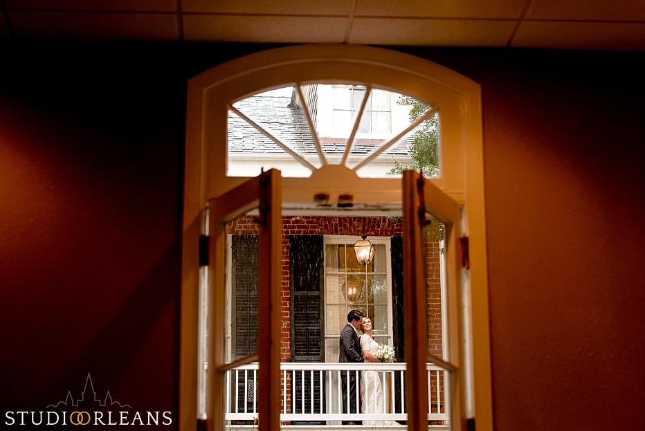 Bride and groom on the balcony at the Chateau Lemoyne Hotel in the French Quarter of New Orleans