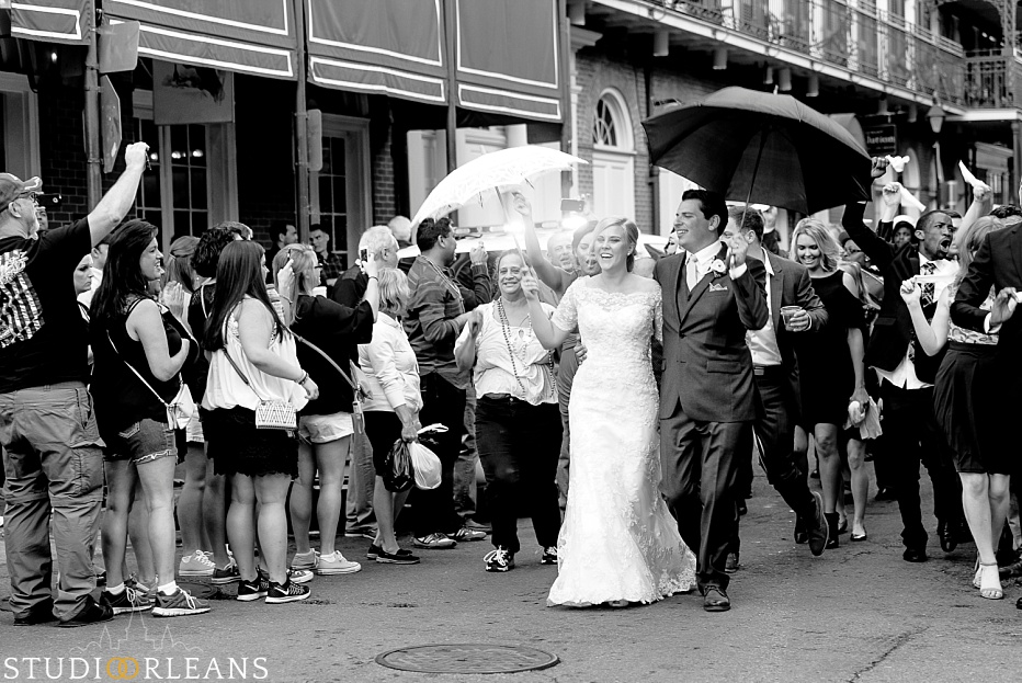 Kinfolk Brass band lead the newly married couple around the French Quarter to celebrate with a Second Line