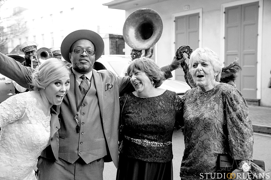 A bride with Kinfolk brass band singer, her mom and her new mother in law