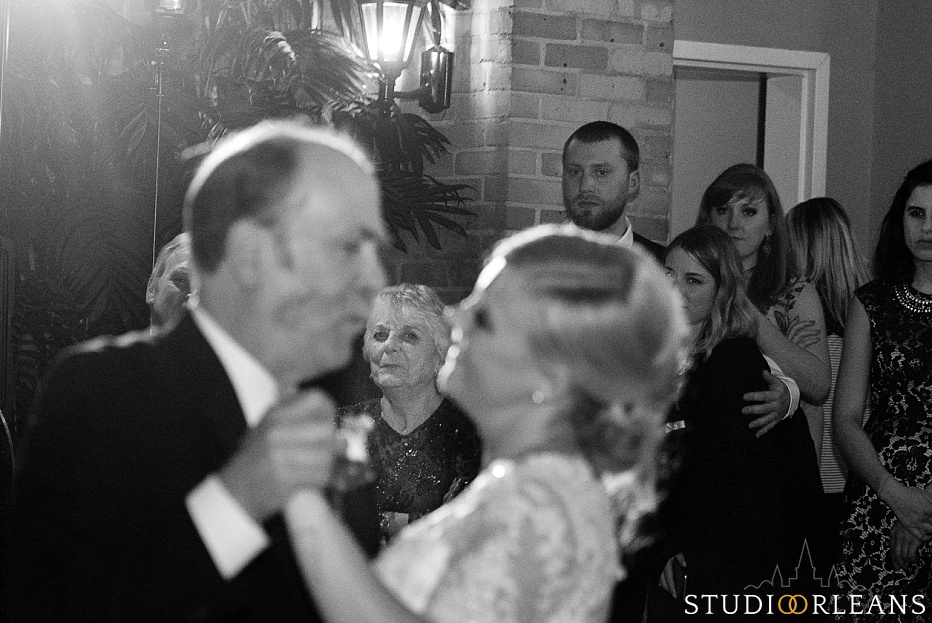 Bride and her father dance in the courtyard at the Chateau Lemoyne Hotel