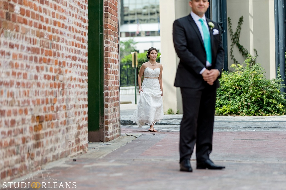 The bride and groom do the first look neer the Old 77 hotel in New Orleans