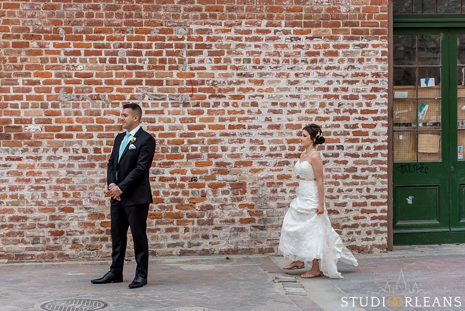 The bride and groom do the first look near the Old 77 hotel in New Orleans