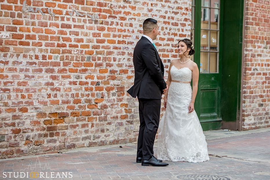 The bride and groom do the first look near the Old 77 hotel in New Orleans