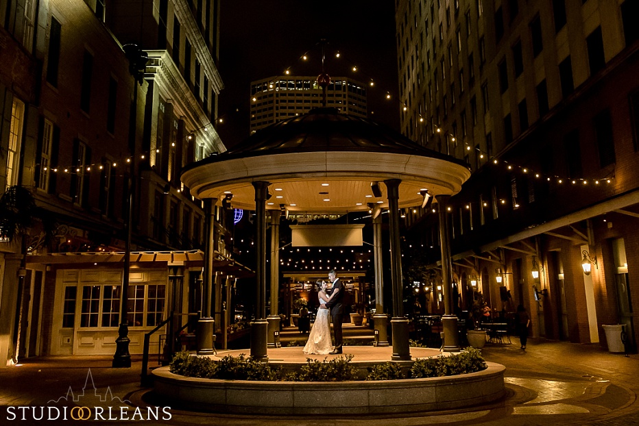We take the couple outside for some nighttime creative portraits by Fulton Alley in New Orleans